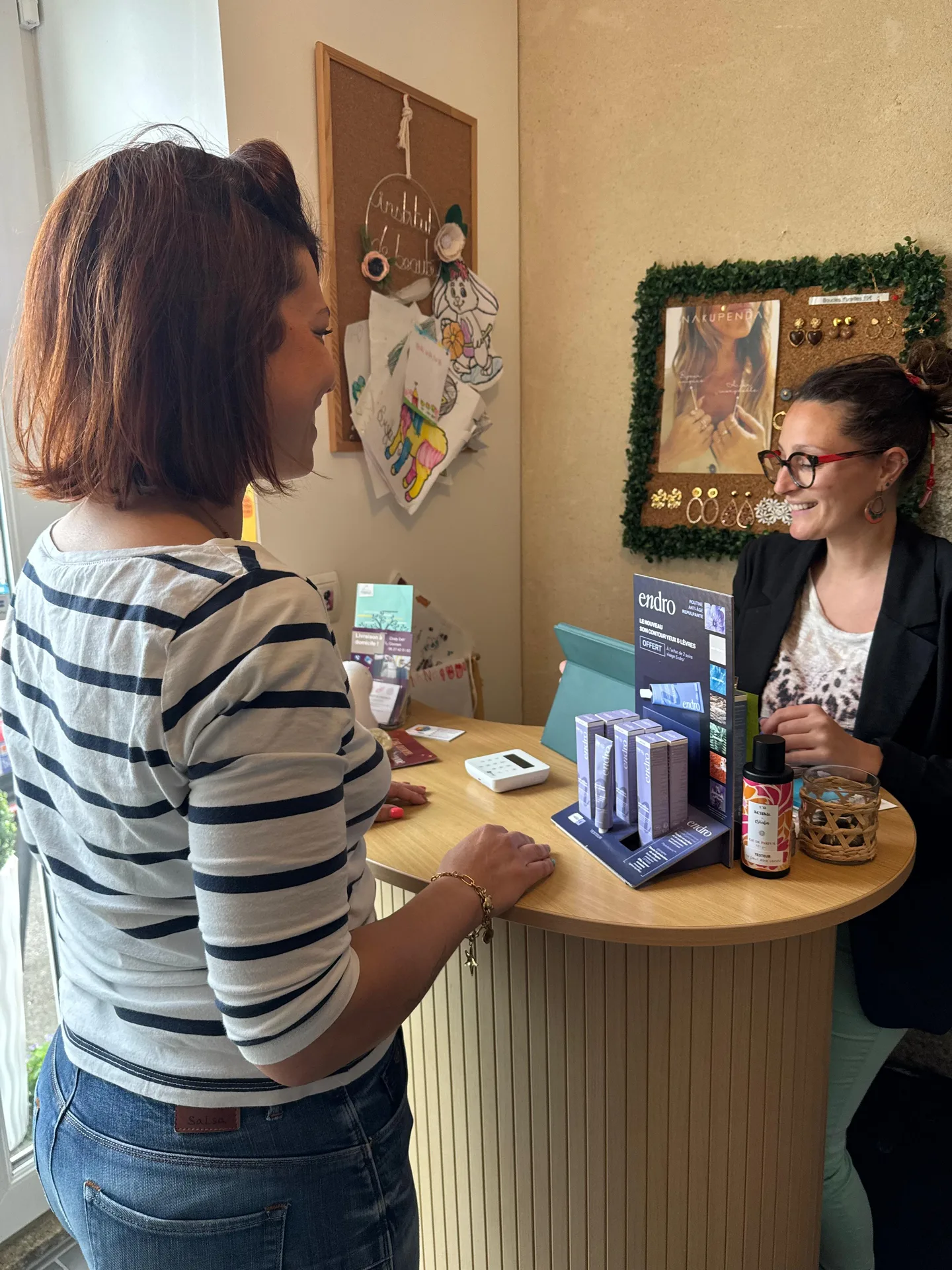 Audrey welcomes a client at La Fée Beauté
